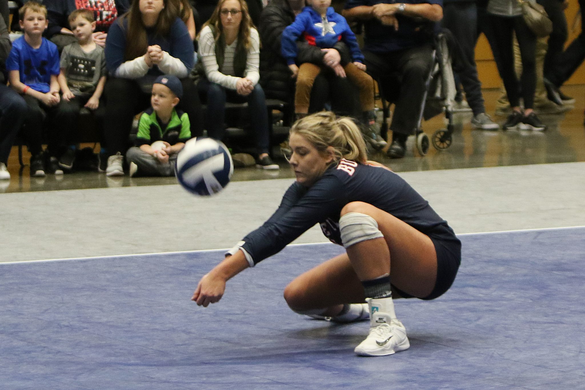A BC player digs the ball out