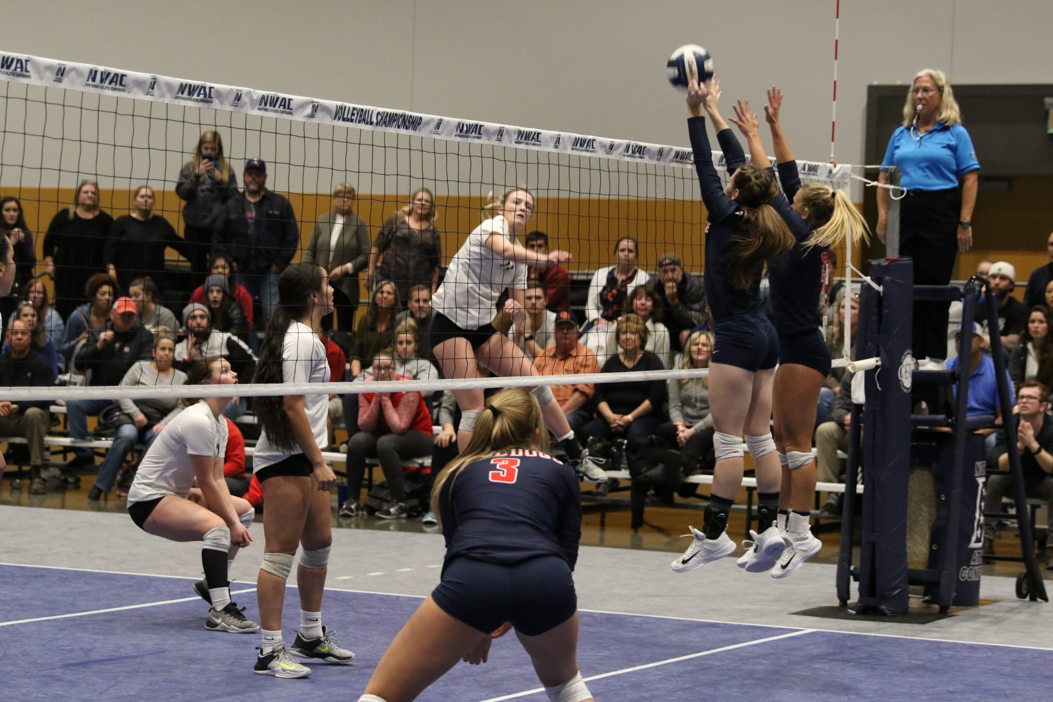 Two BC players go up for a block