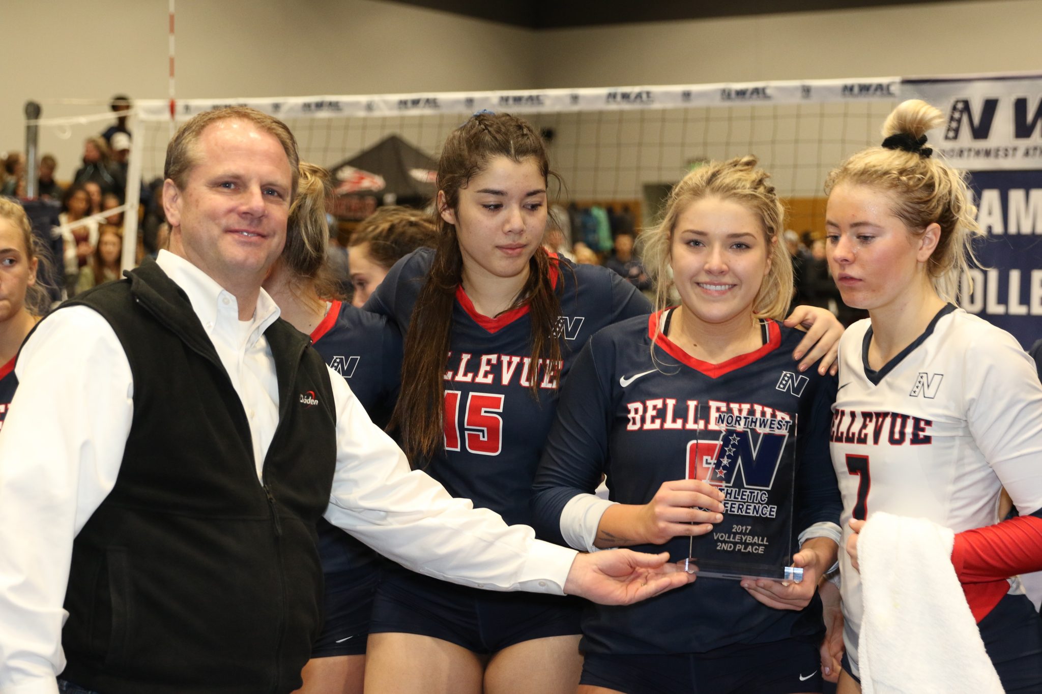 Three BC players accept the runner-up trophy