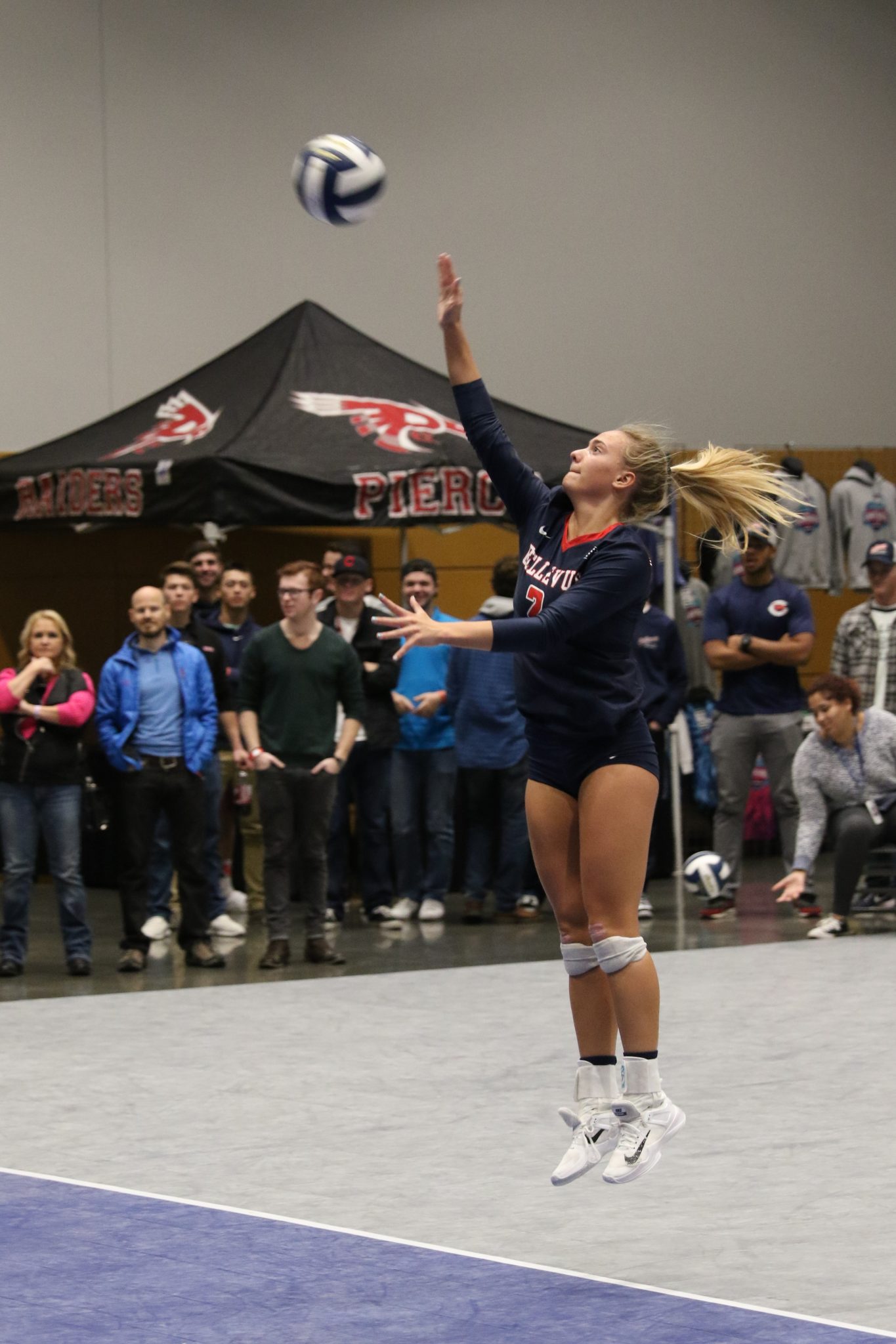 A BC player makes a jump serve