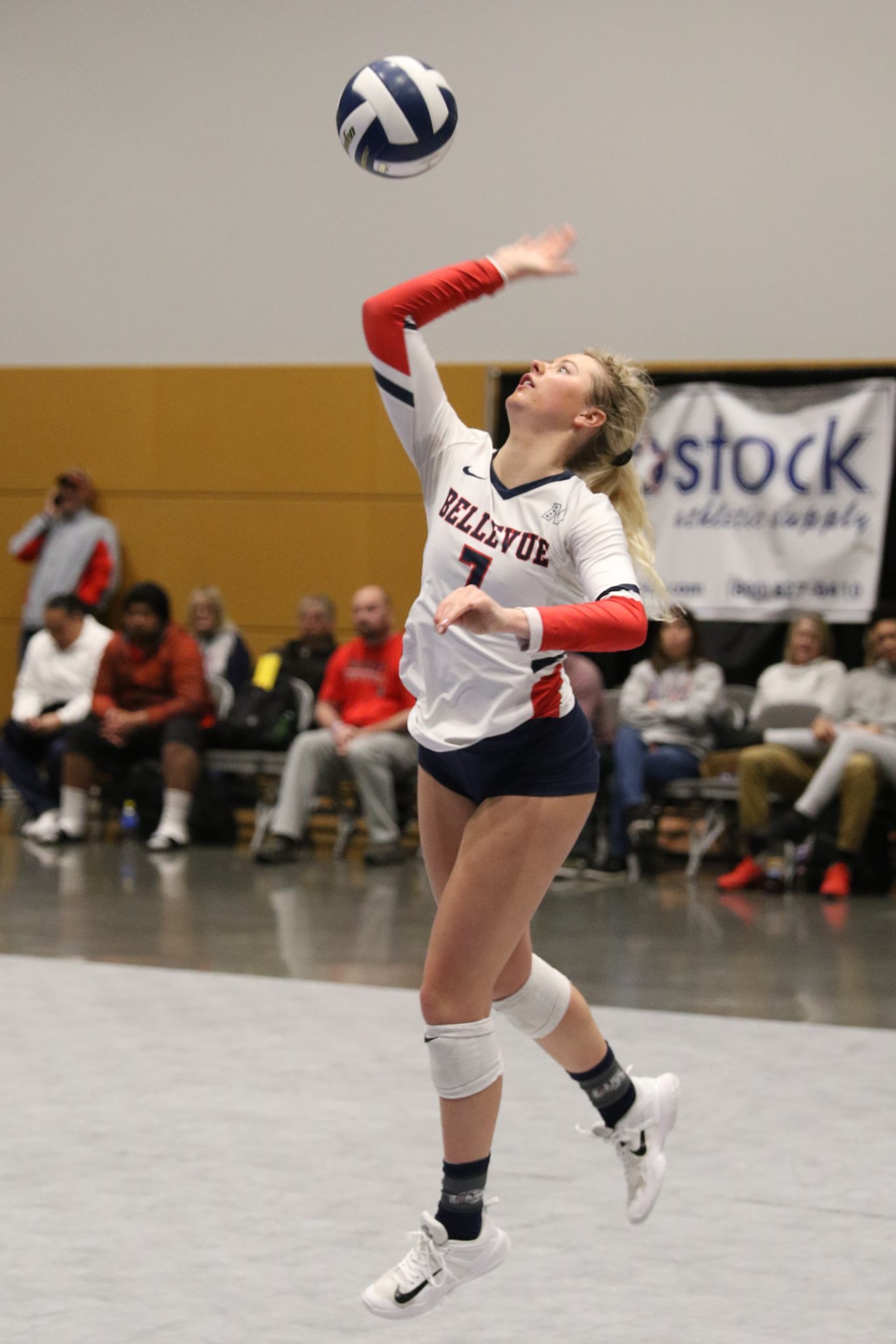 A BC player serves the ball
