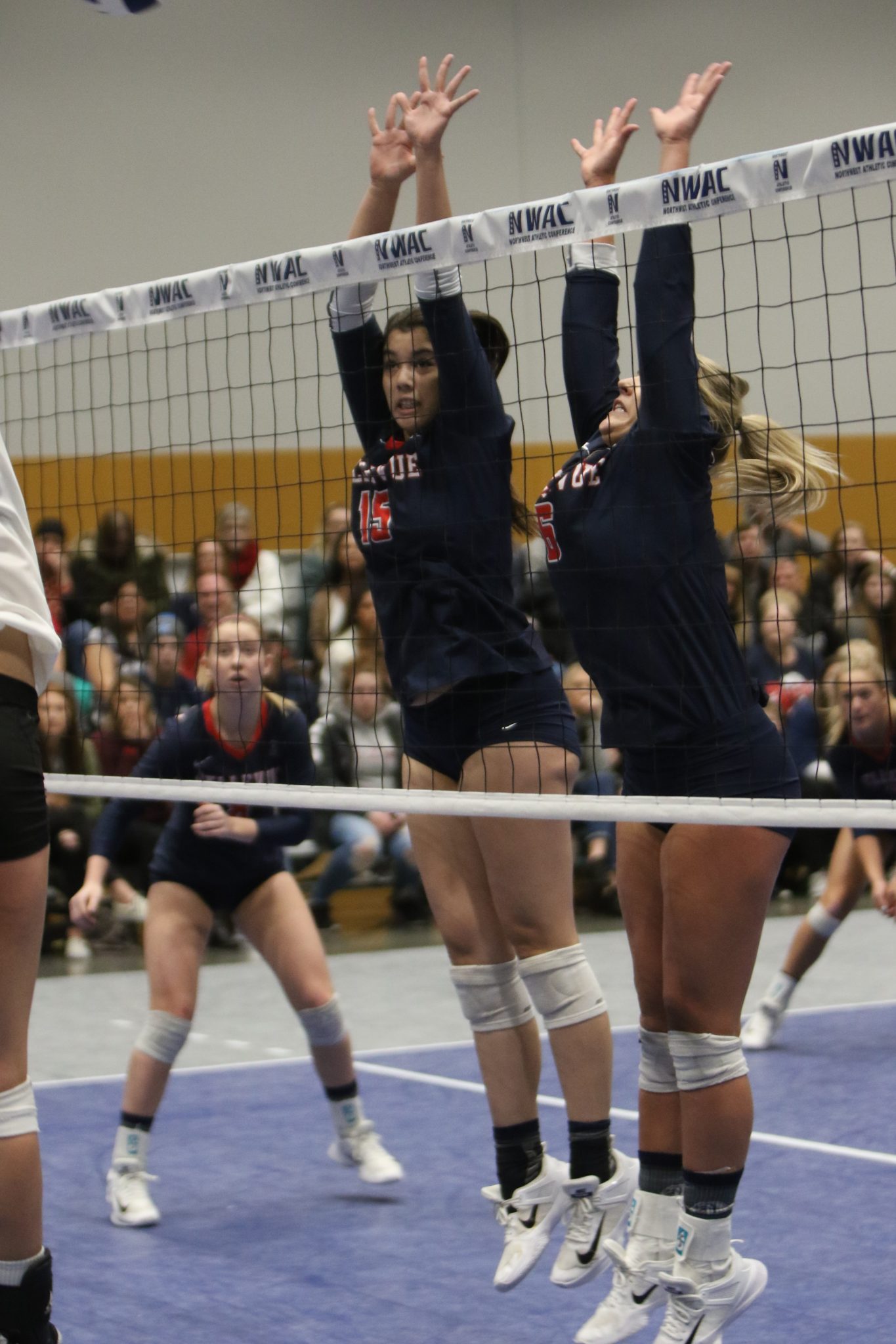 Two BC players go up for a block