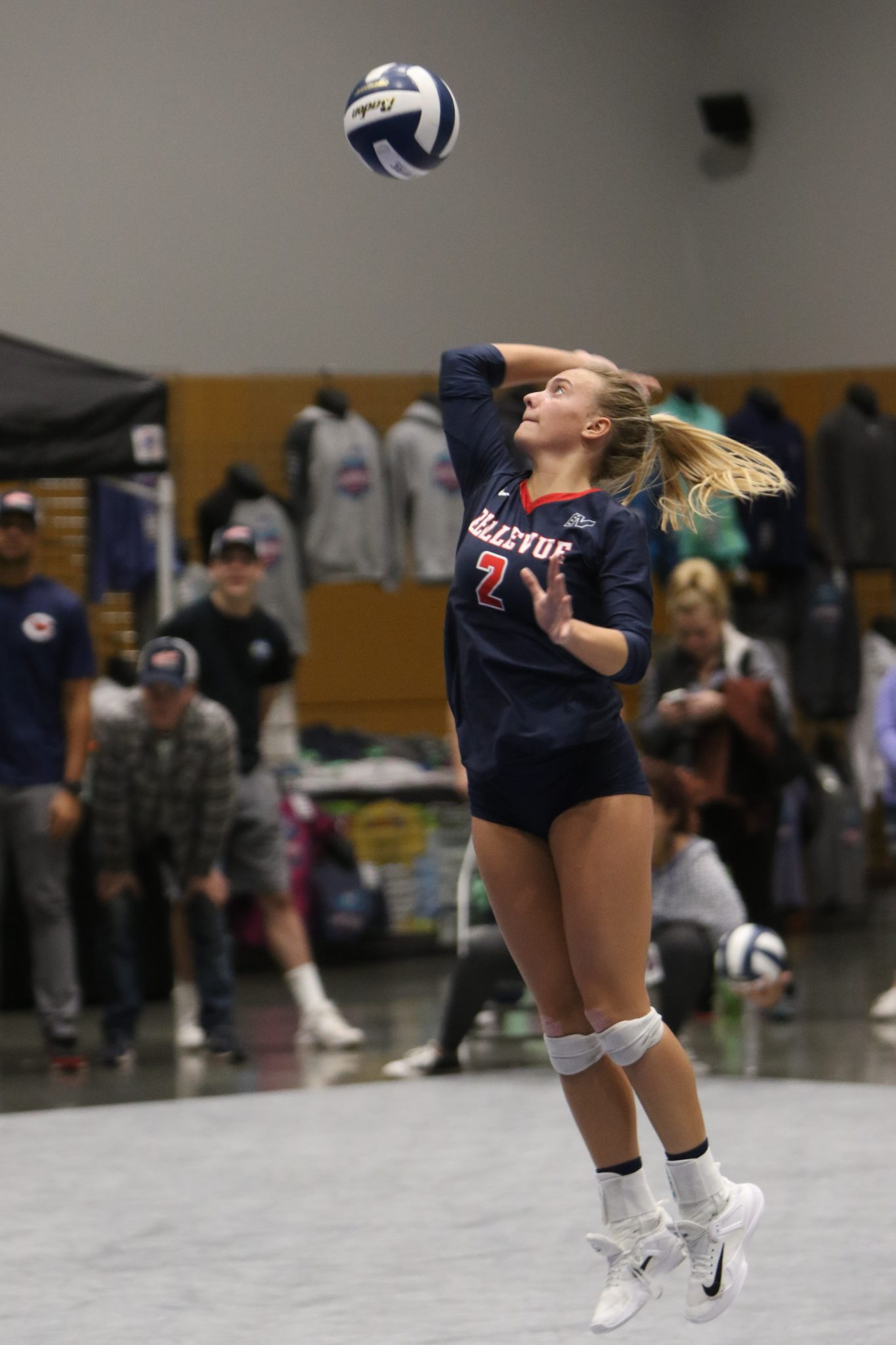A BC player makes a jump serve