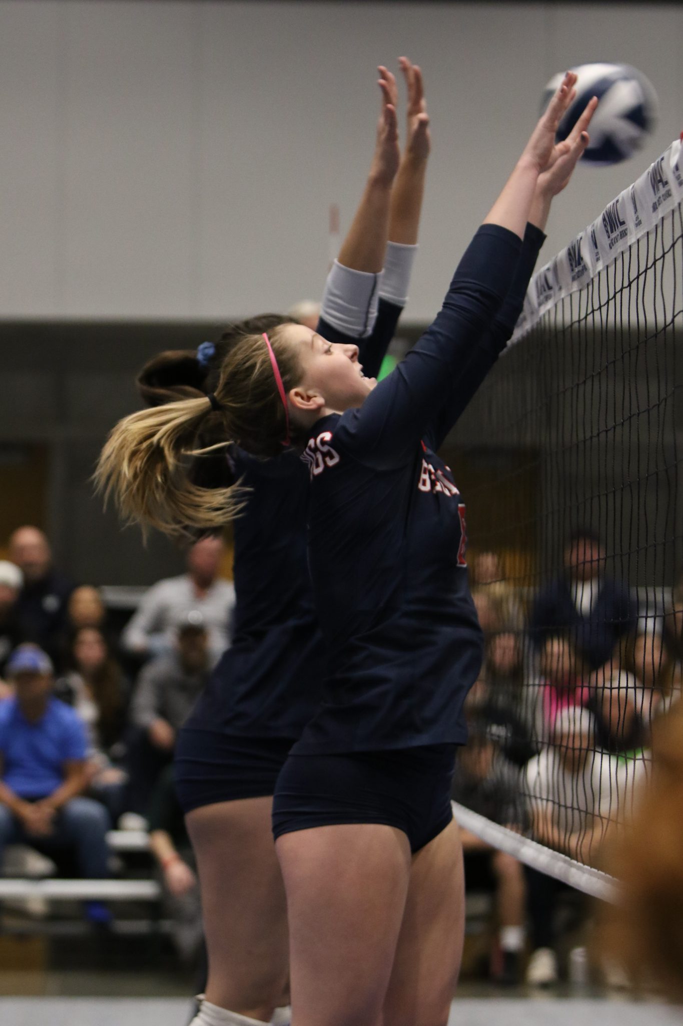 Two BC players go up for a block