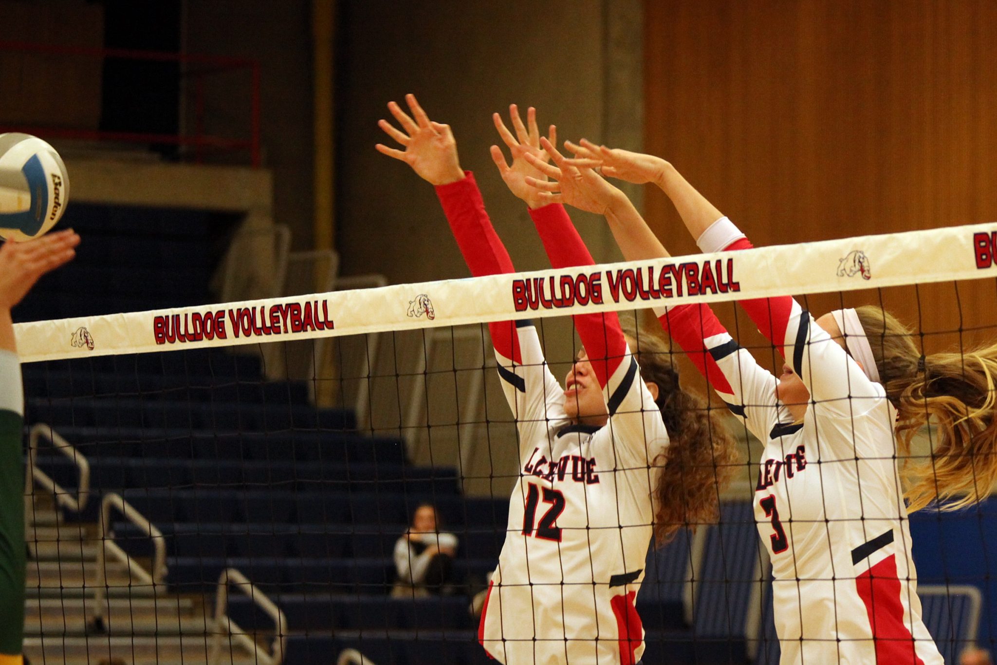 Two BC players go up for a block
