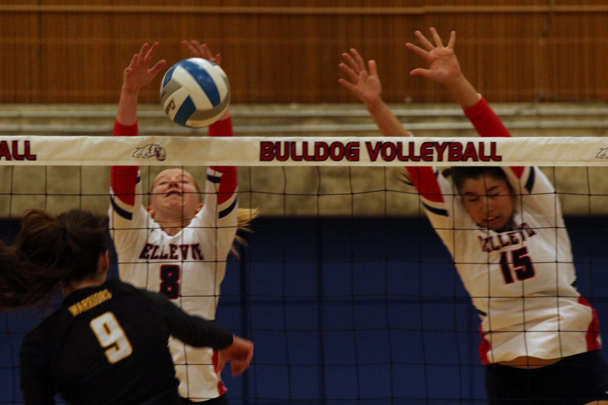 Two BC volleyball players go for the block