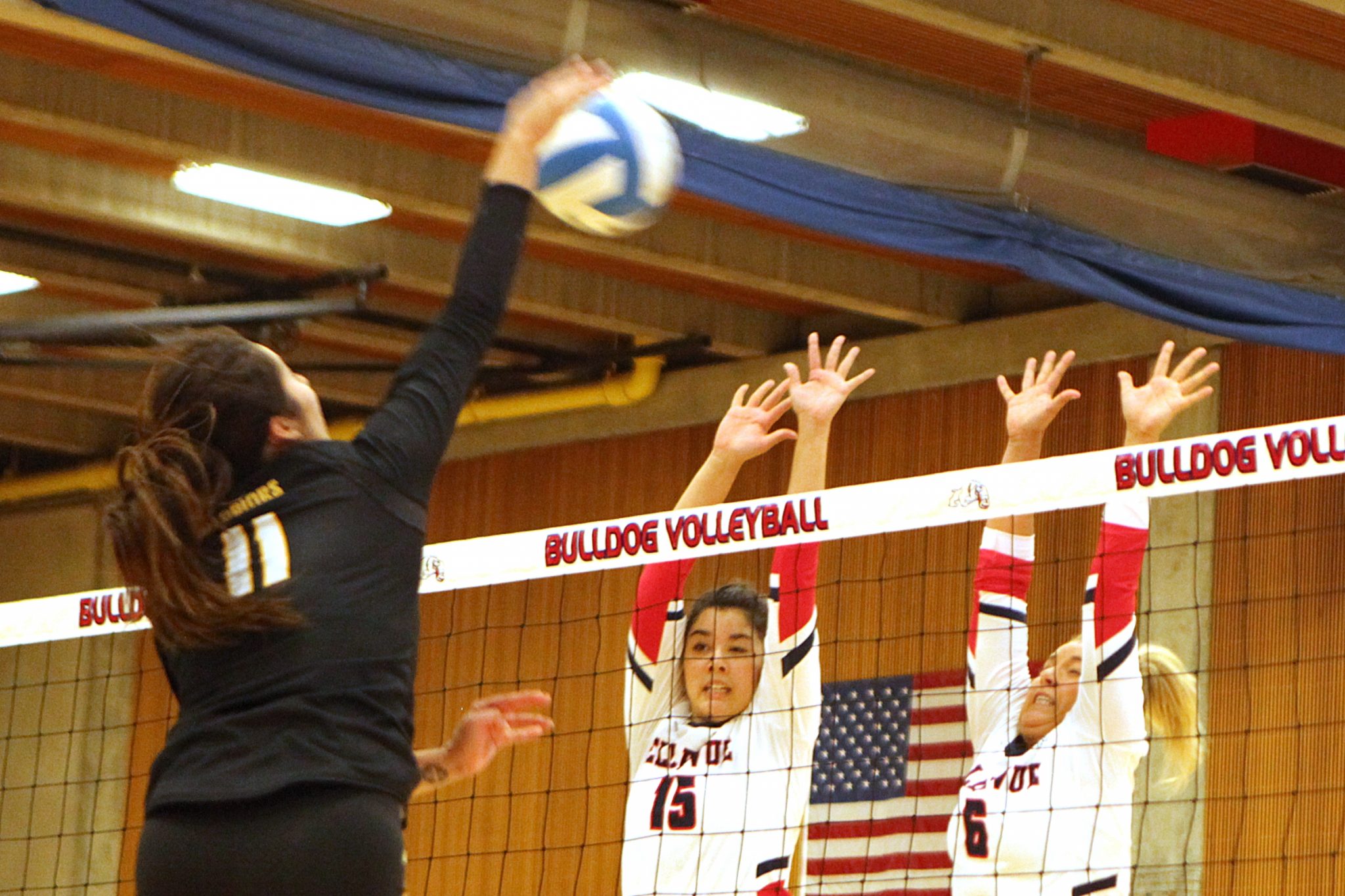 Two BC volleyball players go for the block