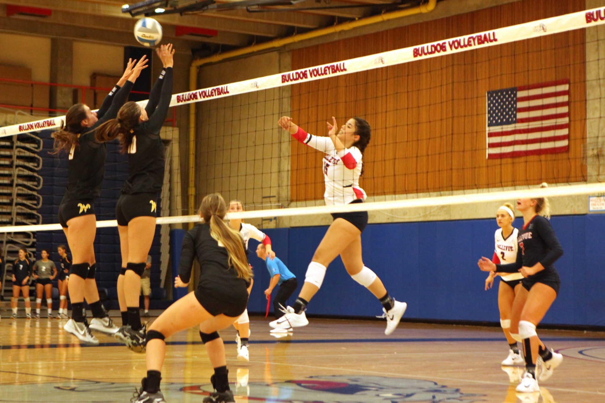 A BC volleyball player hits a shot