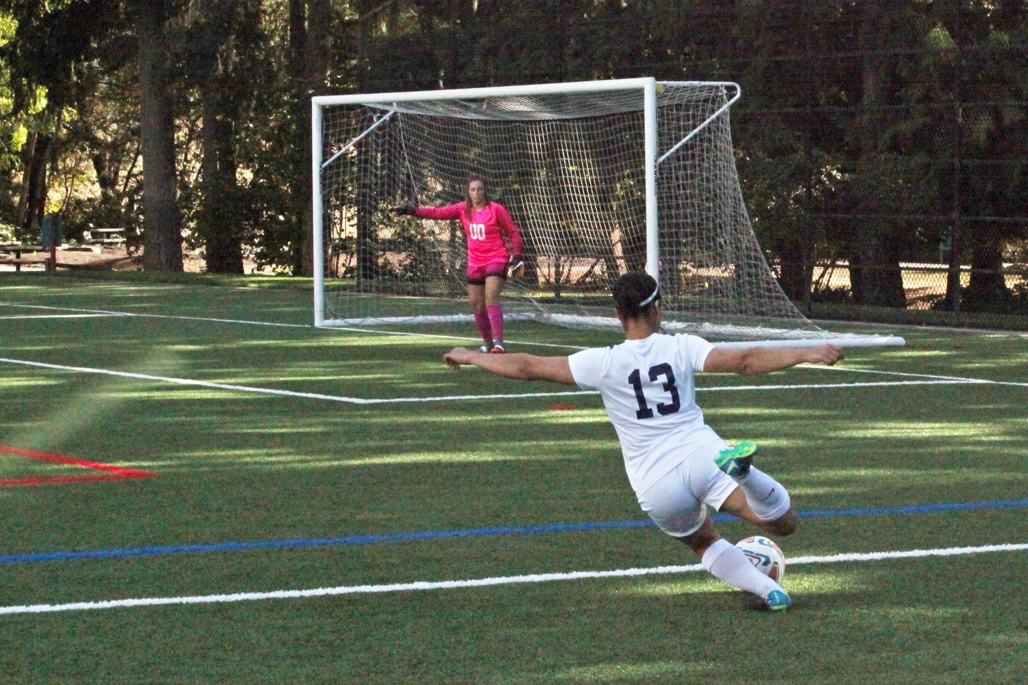 A BC player attempts a shot on goal