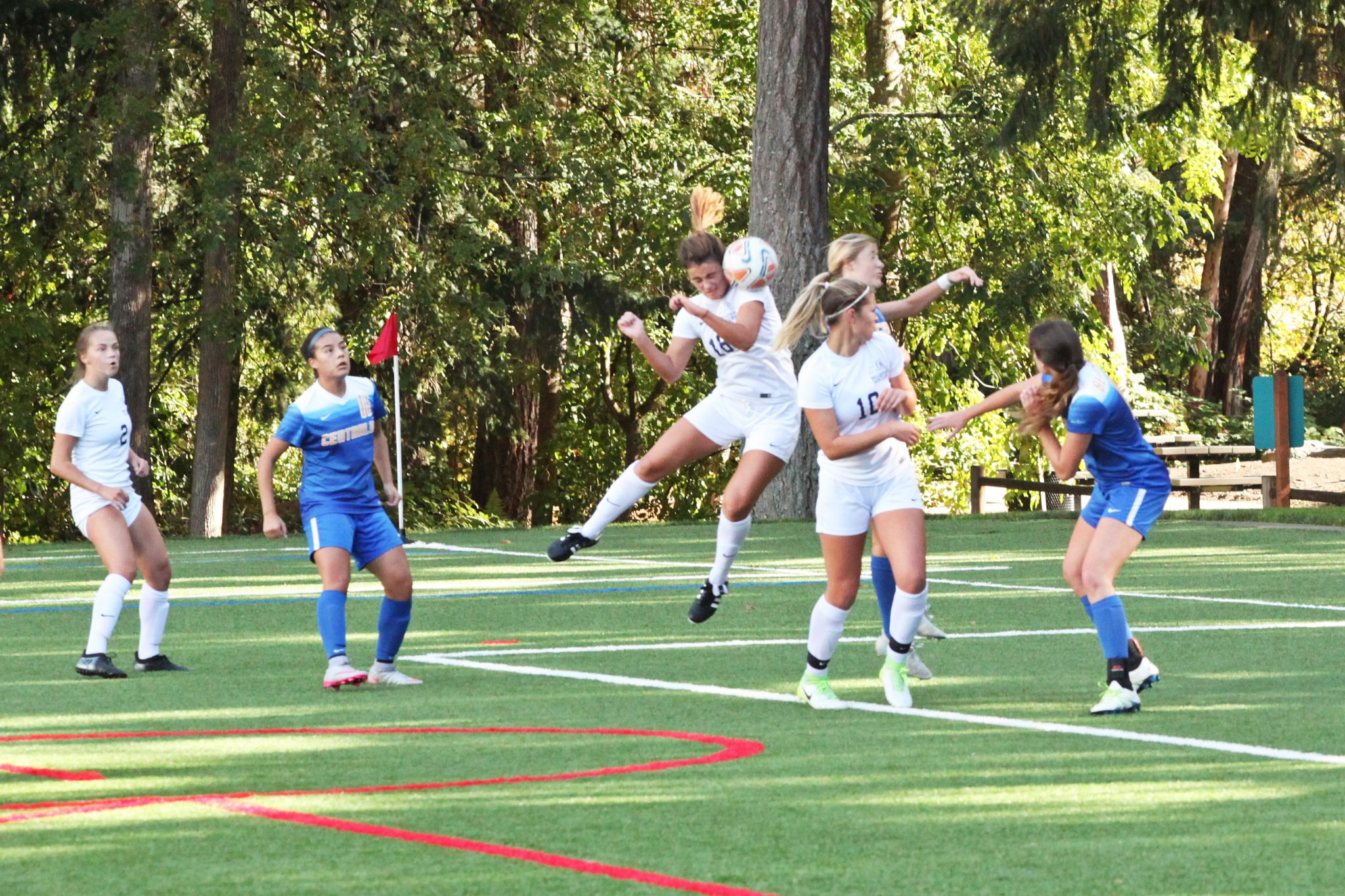 A BC player heads the ball