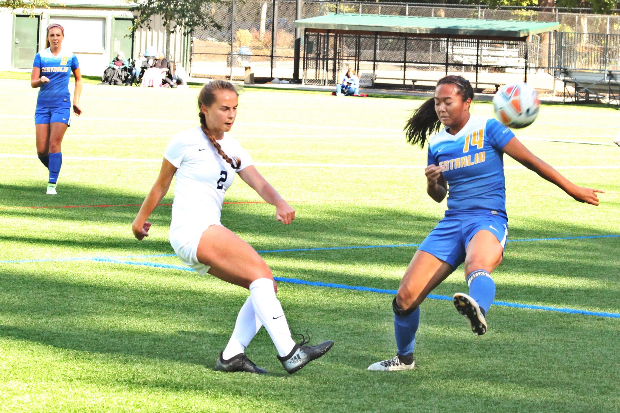 A BC player kicks the ball forward