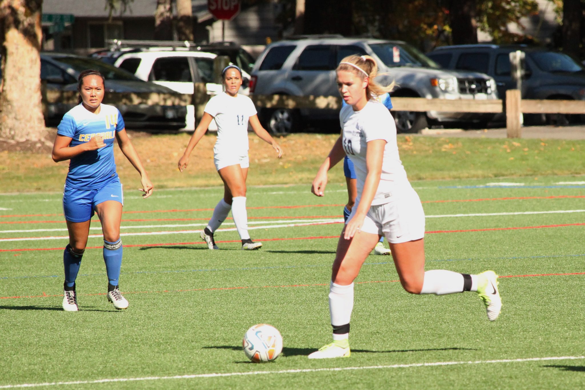 A BC player pushes the ball upfield
