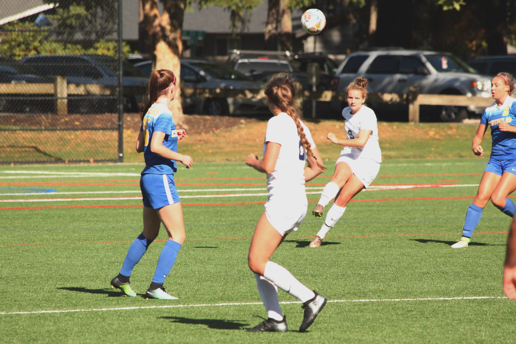 A BC player kicks the ball ahead