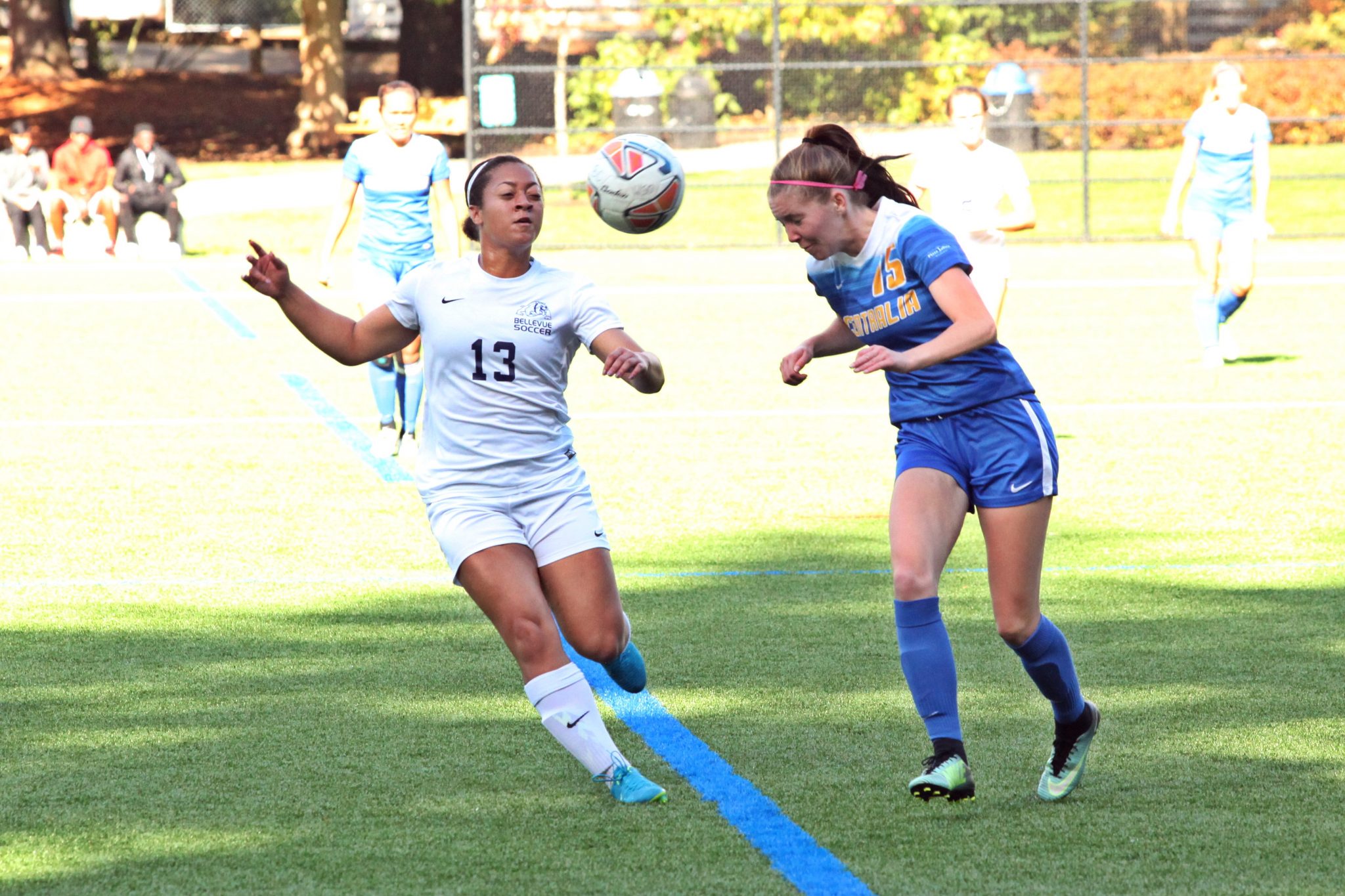 A BC player defends an opponent's header