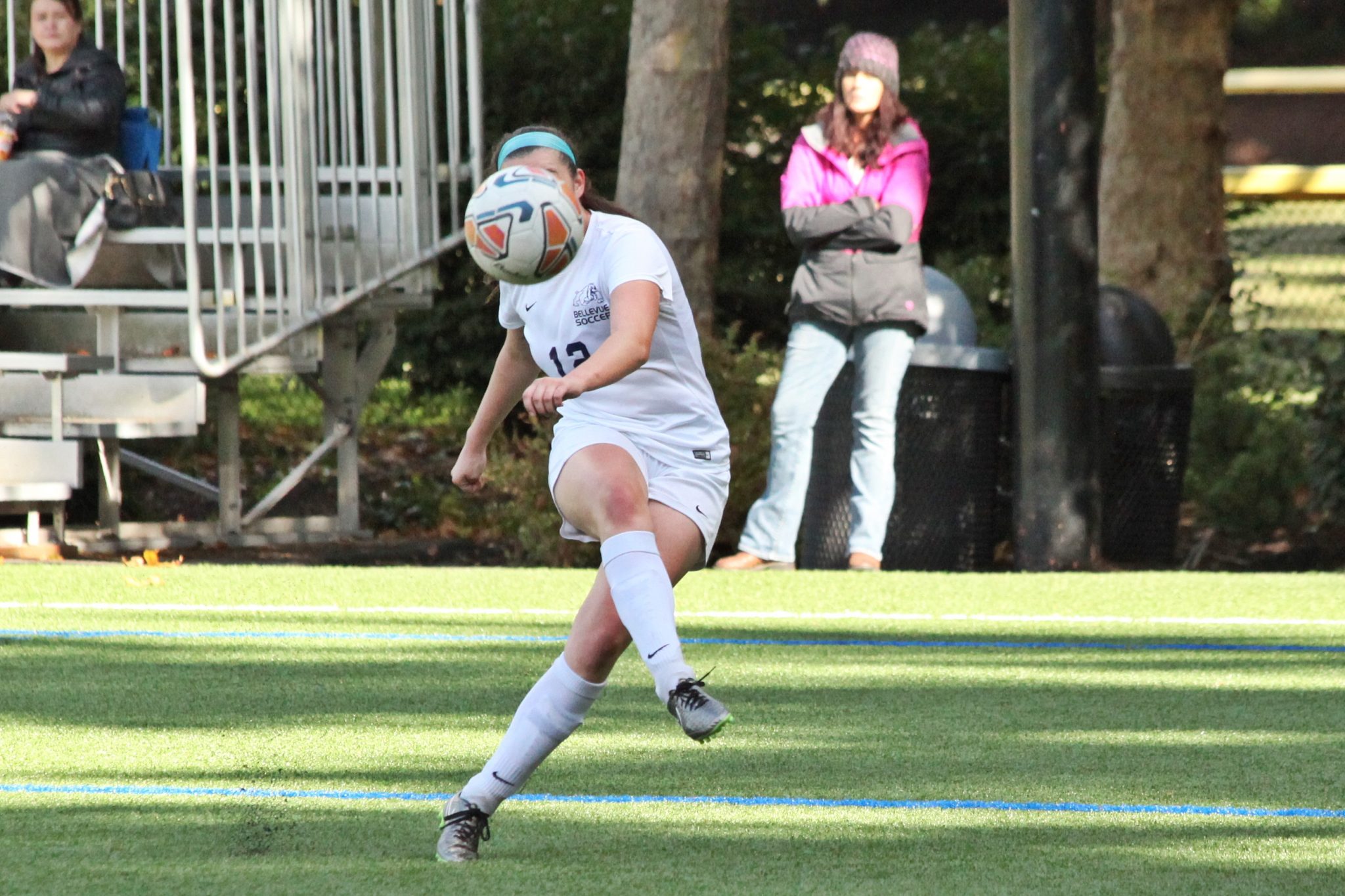 A BC player kicks the ball