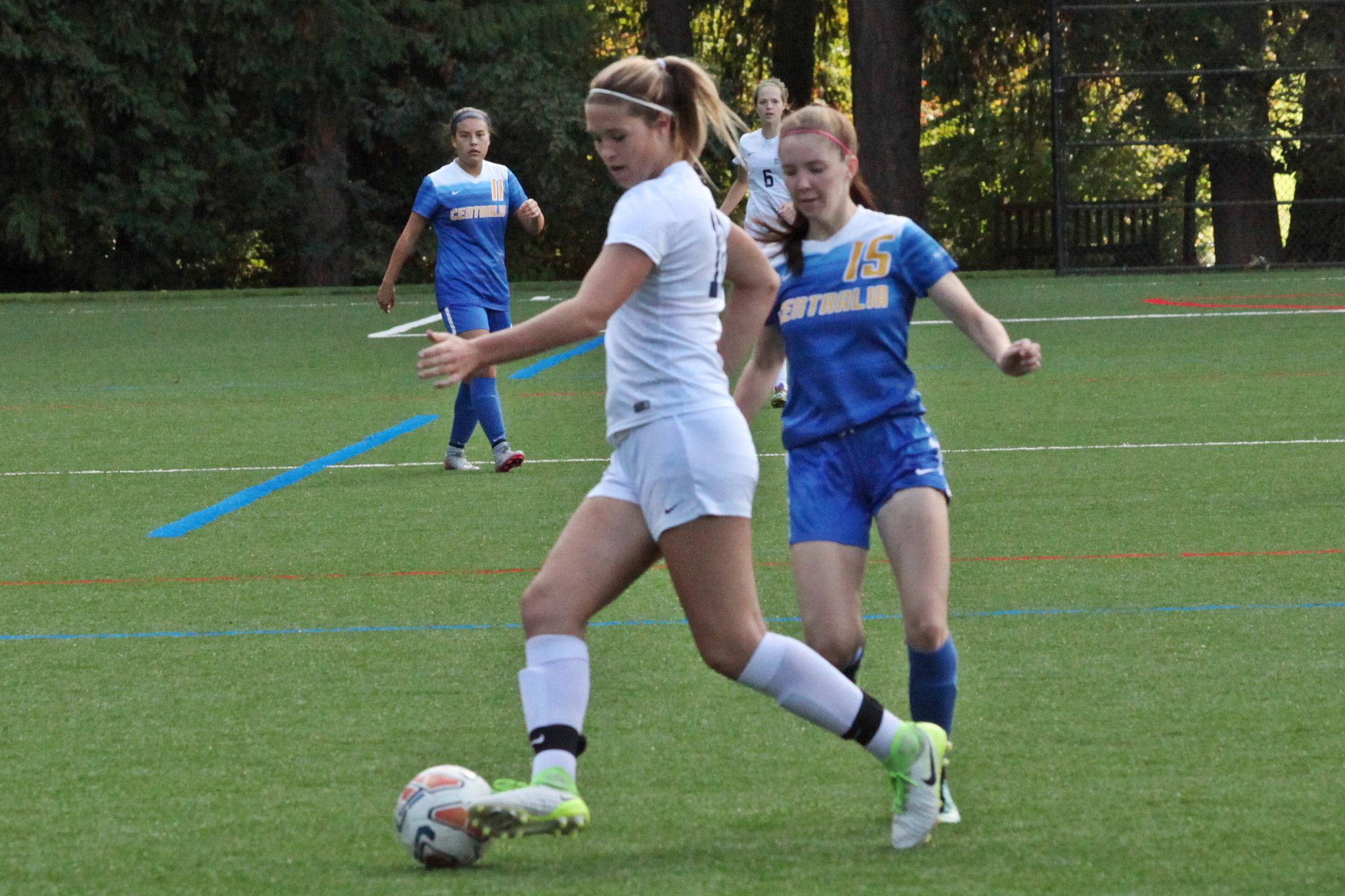 A BC player pushes the ball upfield