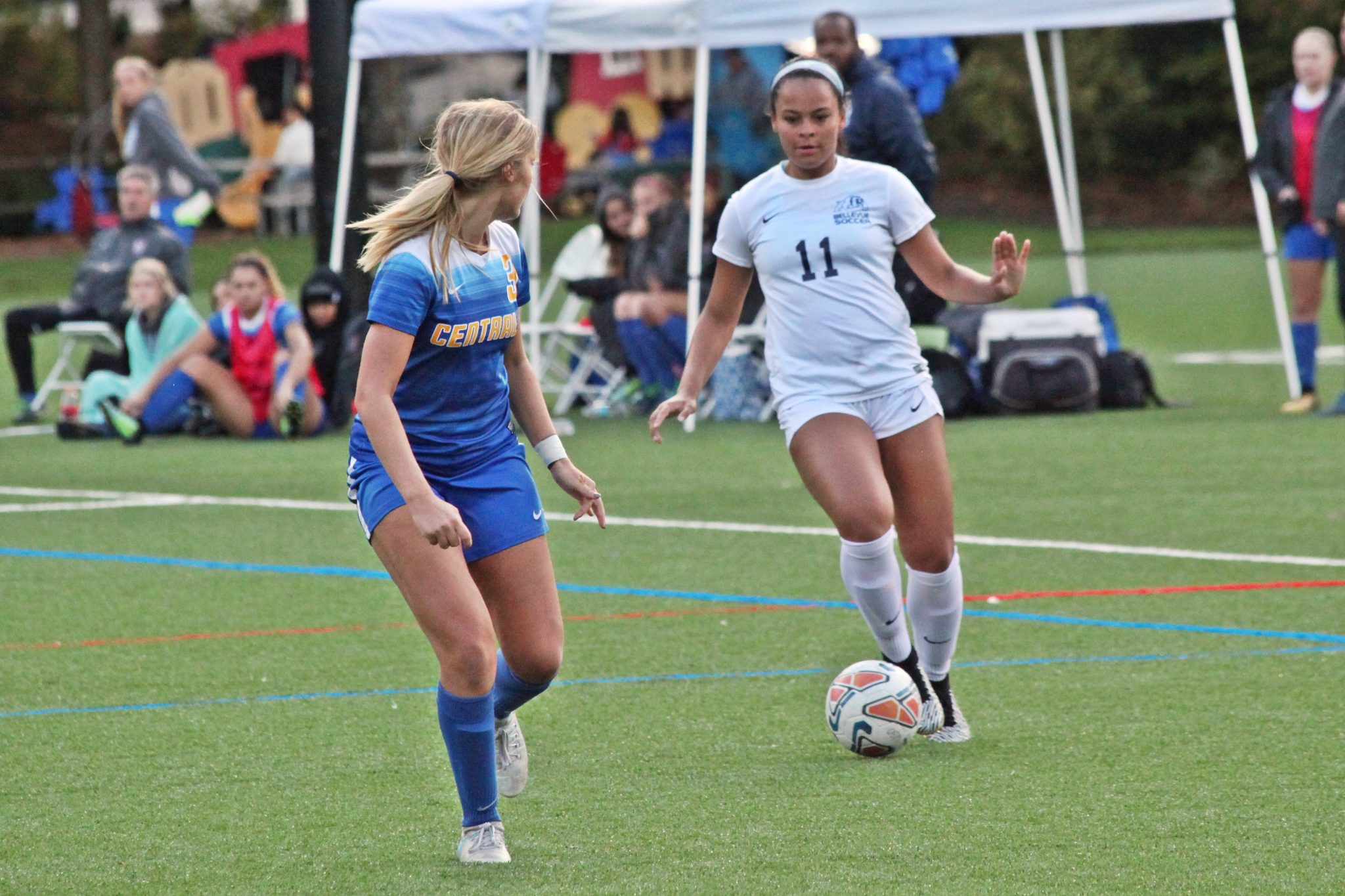 A BC player dribbles the ball aginast a defender