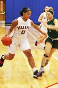 BC women's basketball player Melinda Akoto dribbles the ball against a defender