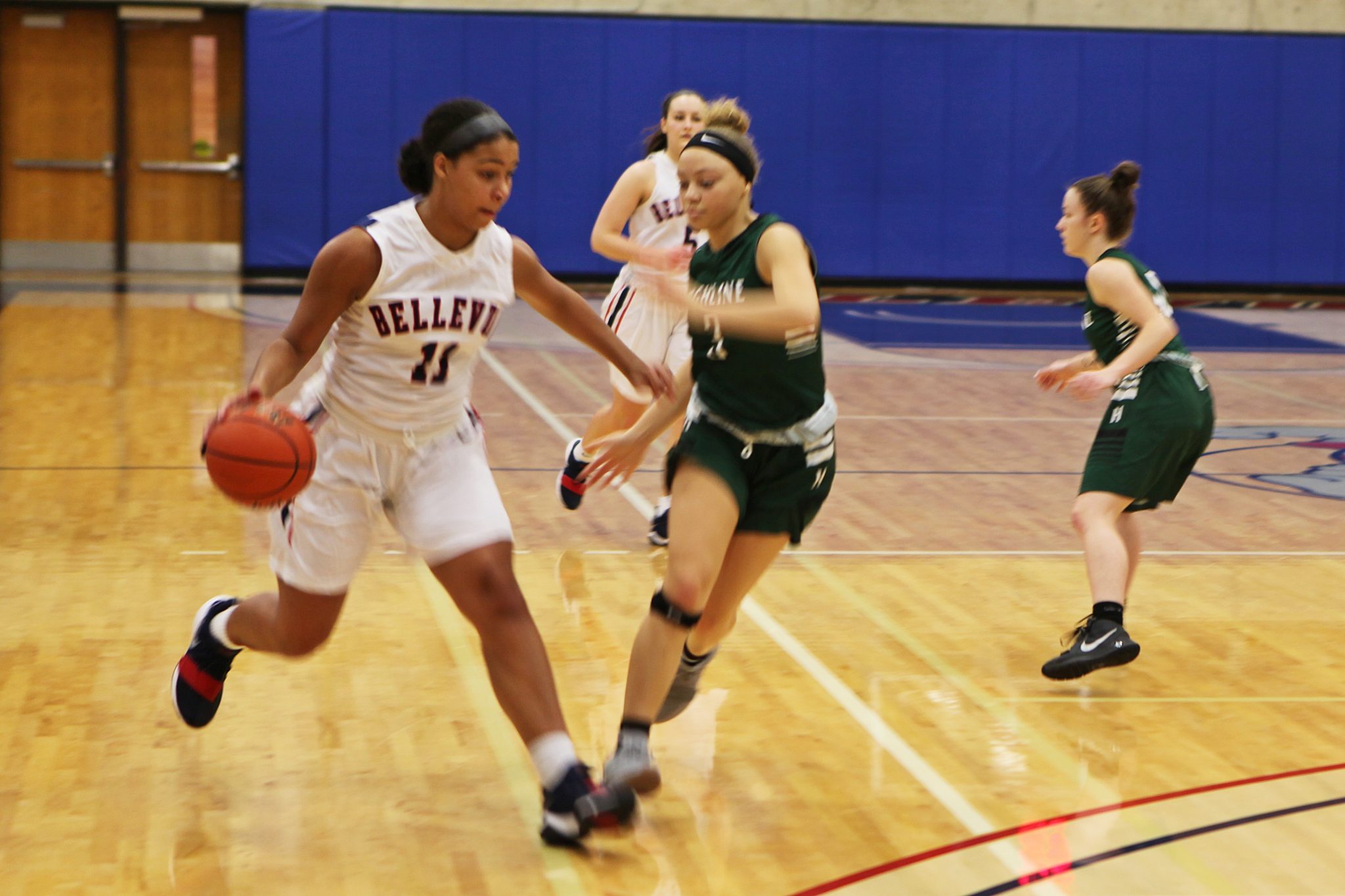 A BC player dribbles the ball against a defender
