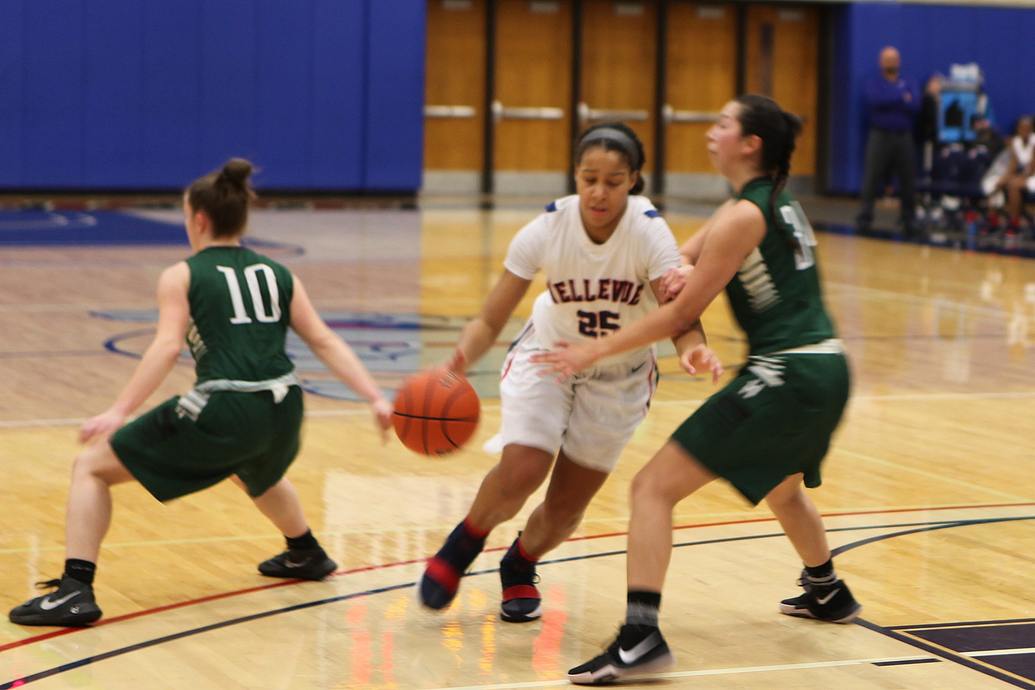 A BC player dribbles the ball against a defender