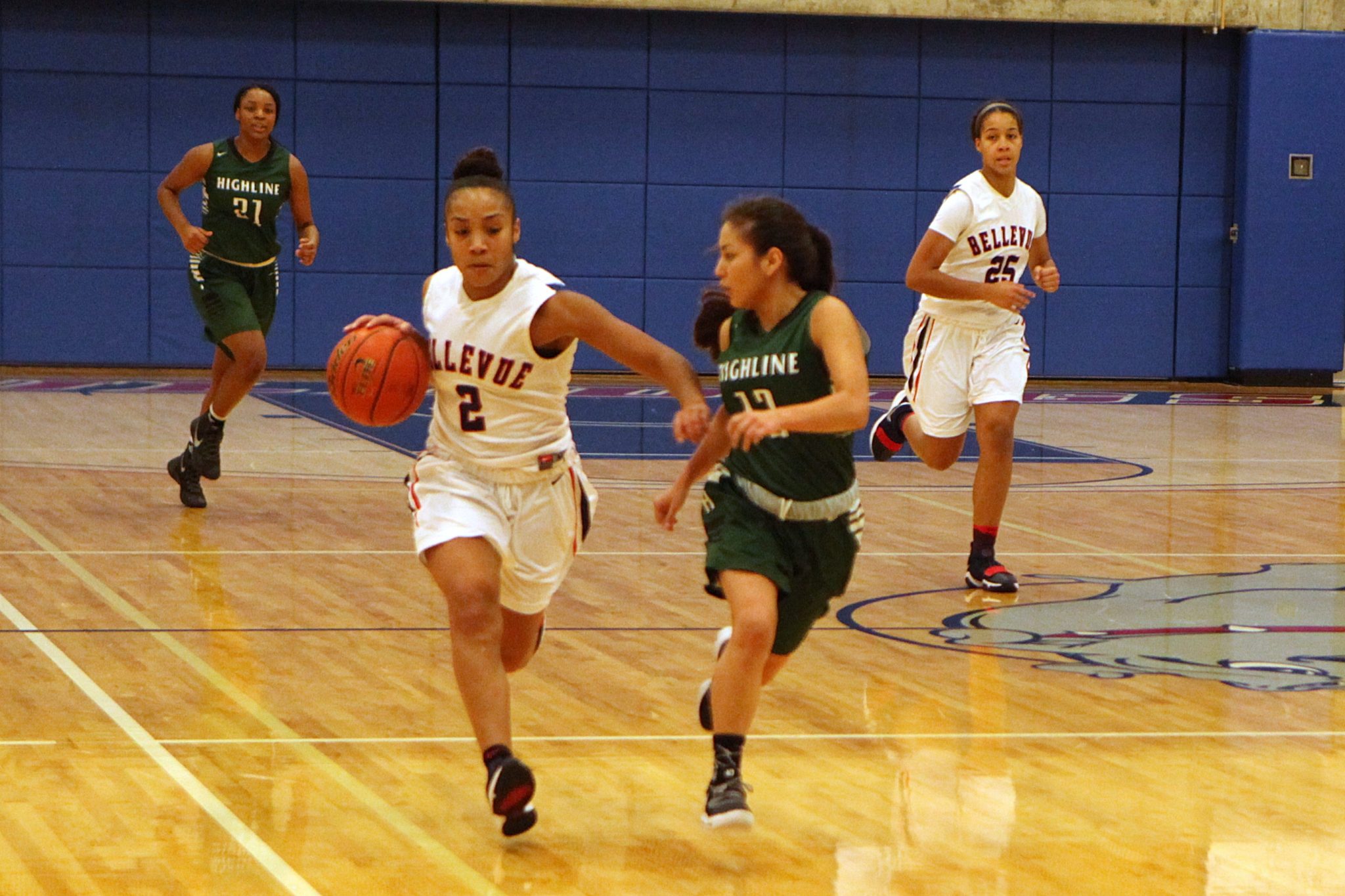 A BC player dribbles the ball up the court