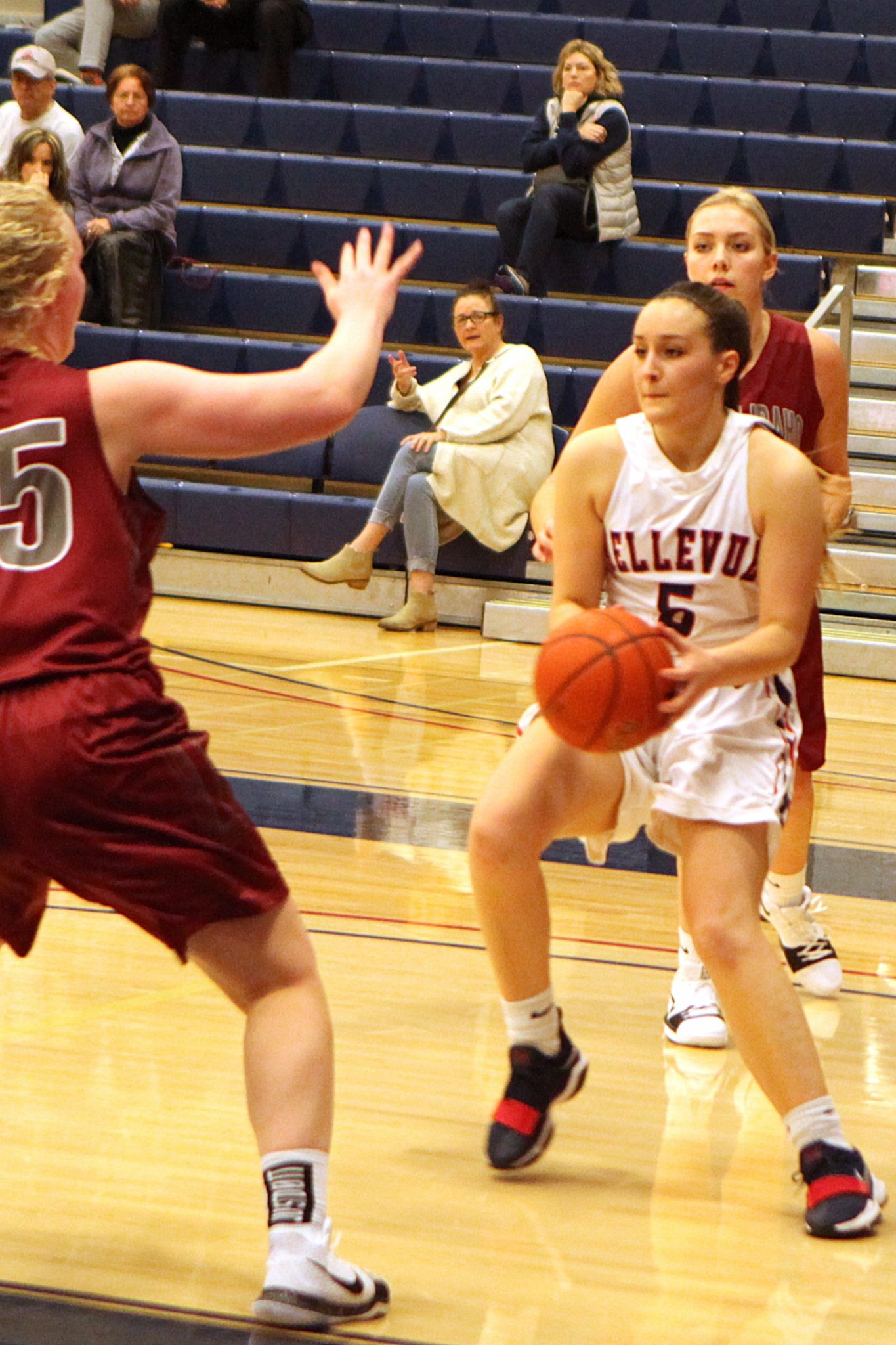 BC women's basketball player Kassin Hopkins controls the ball against a defender