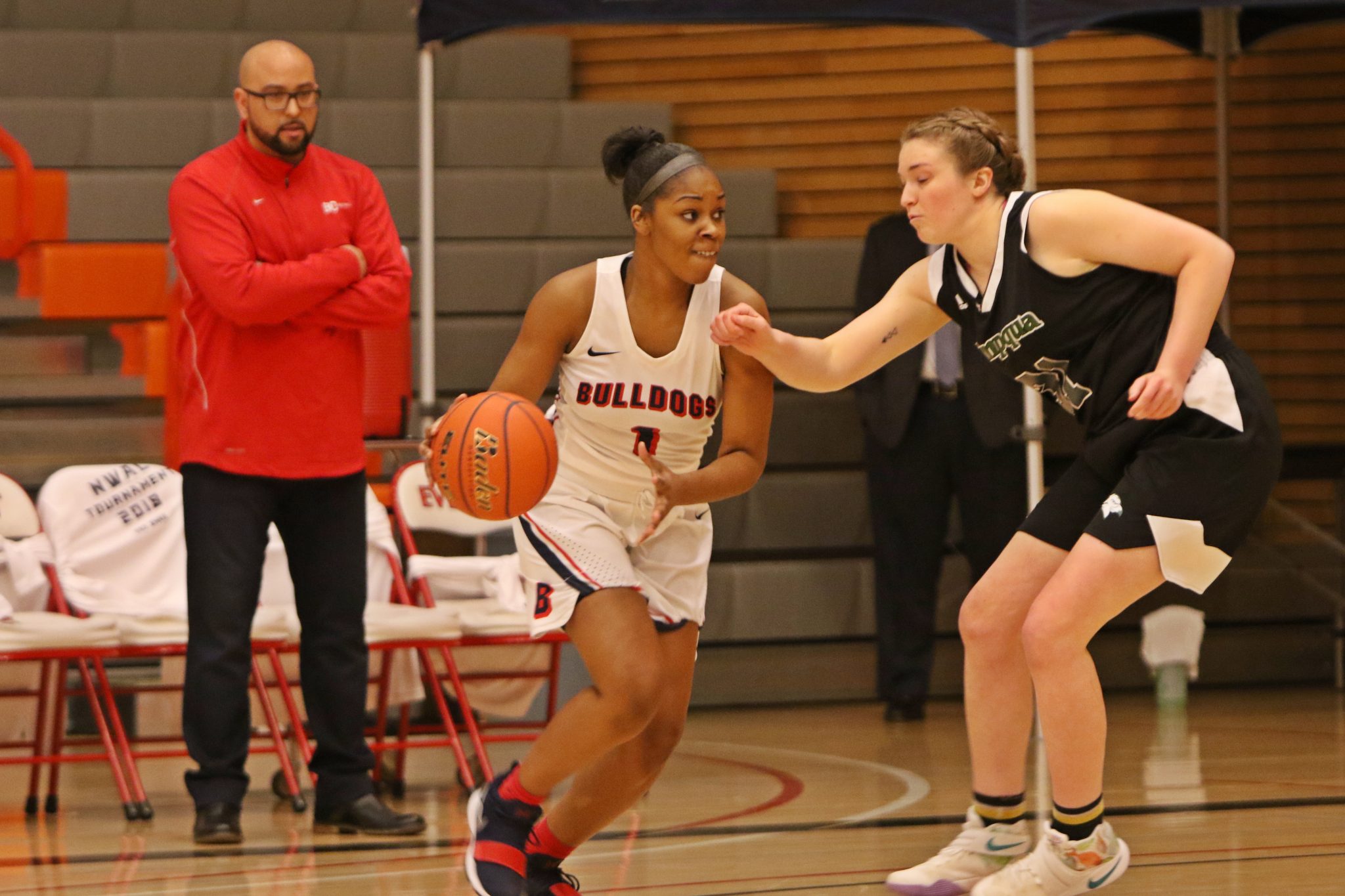 A BC player dribbles past a defender