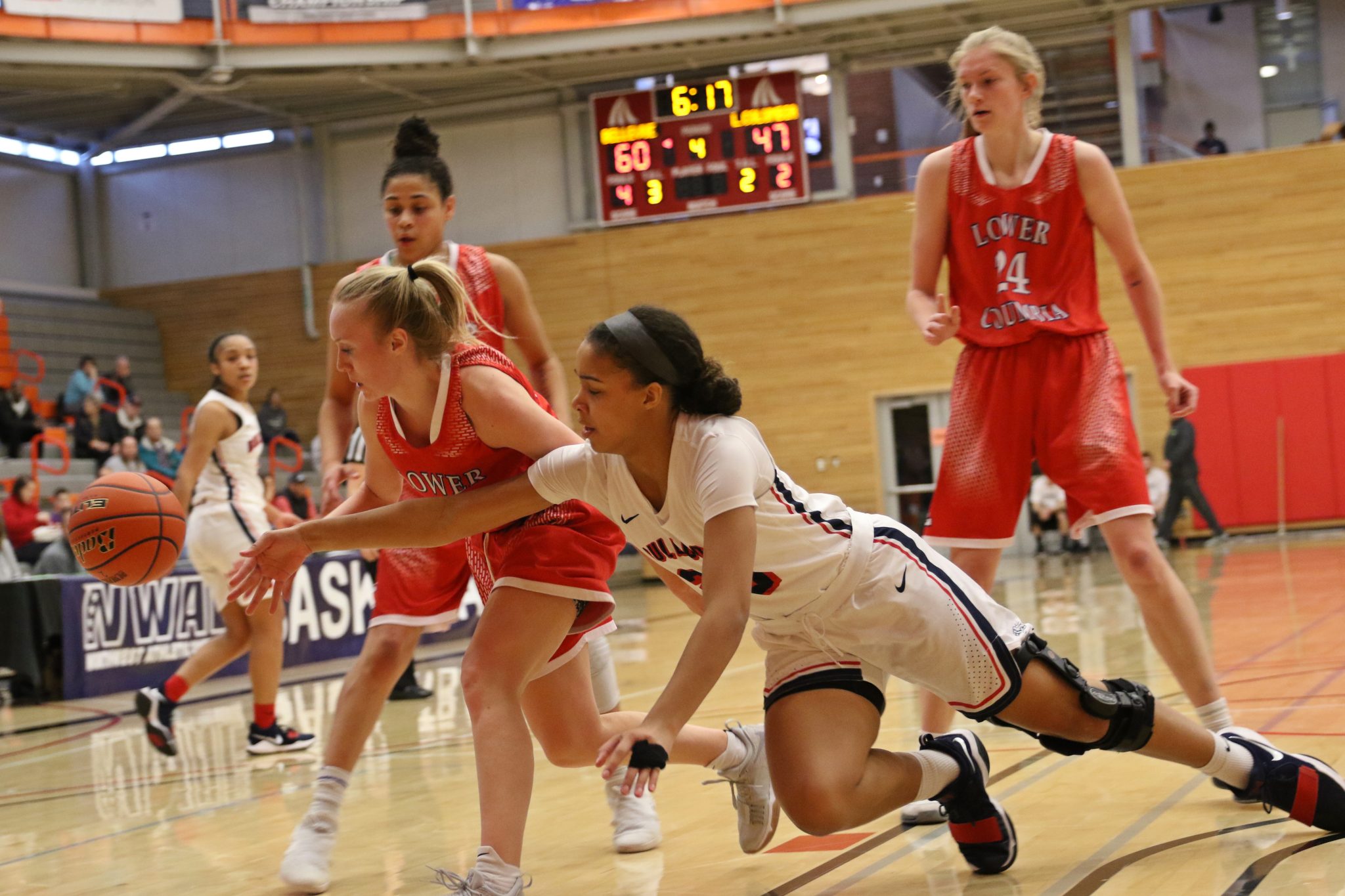 A BC player dives for a loose ball