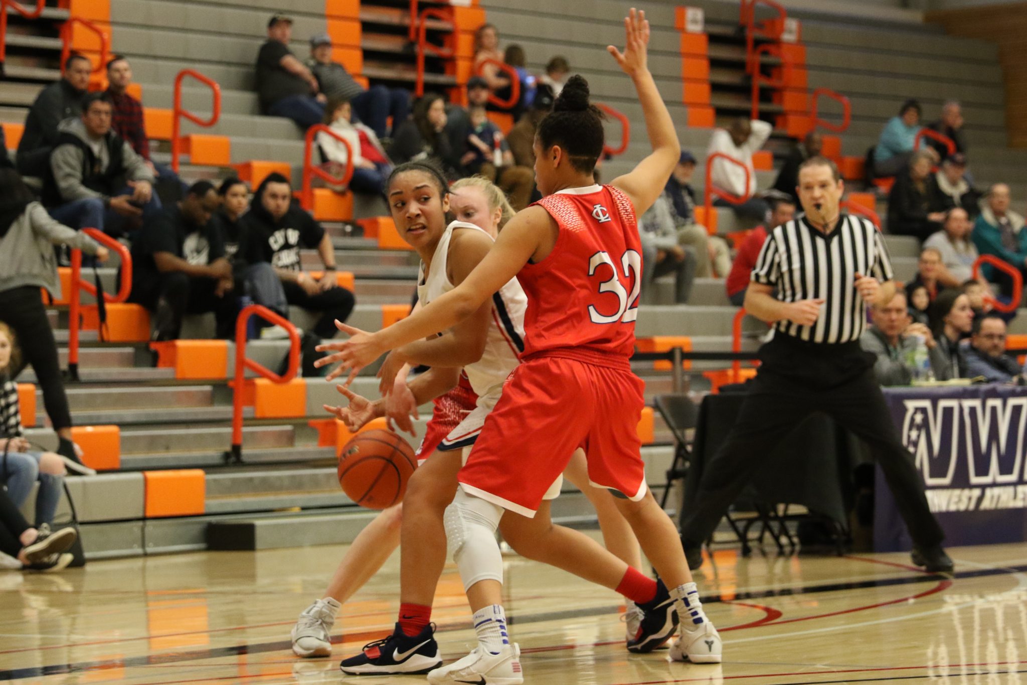 A BC player looks to pass while being closely defendedd