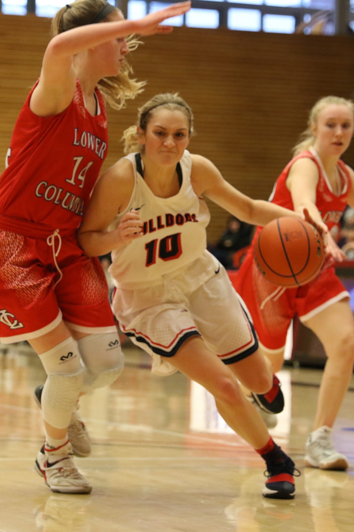 A BC player dribbles against a defender