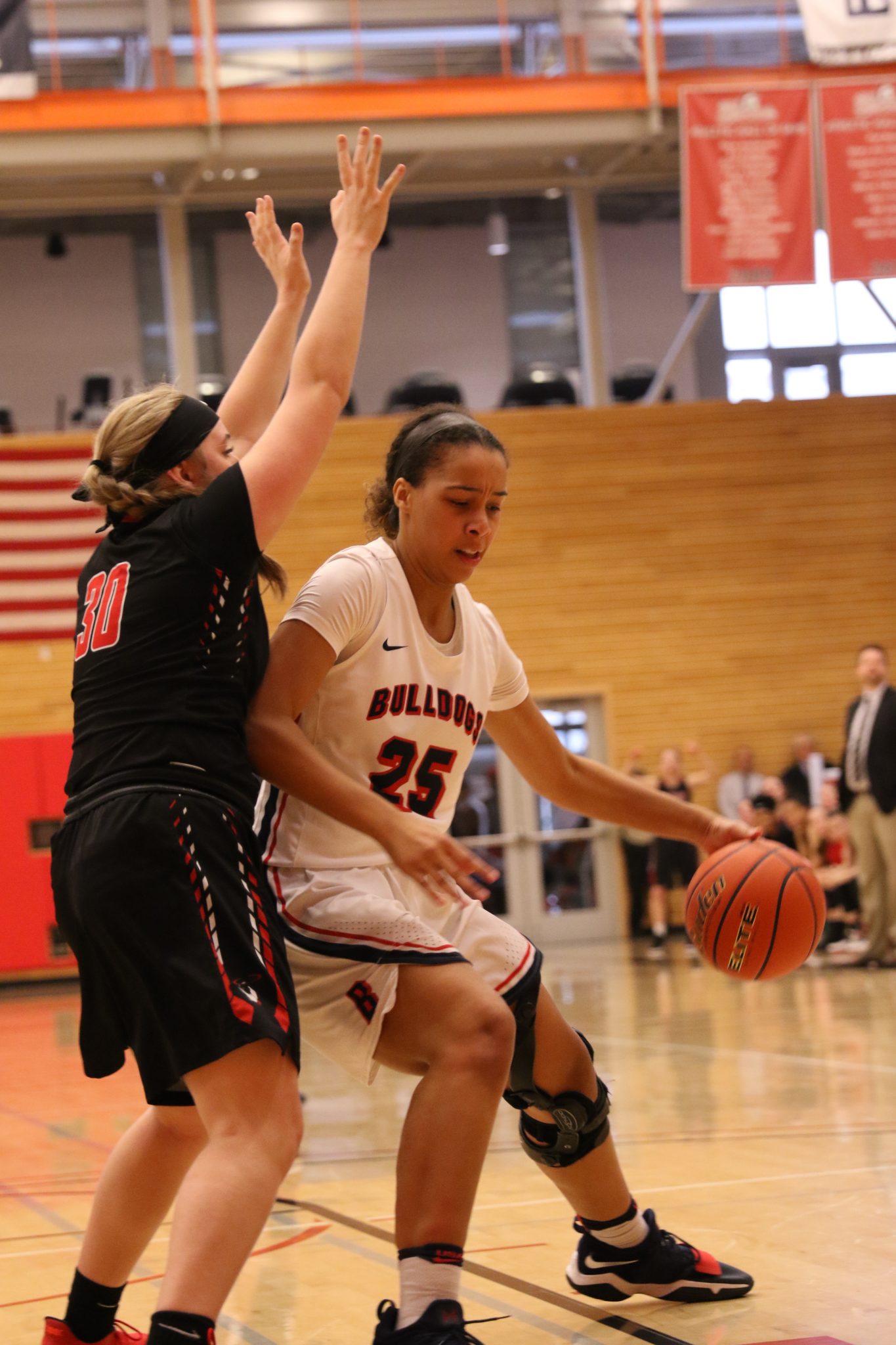 A BC player backs in against a defender