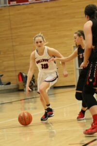 A BC player dribbles the ball past a defender