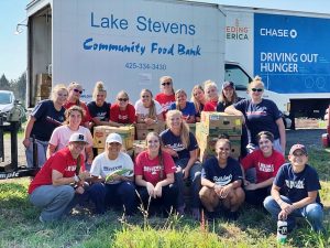 BC softball team in front of the Lake Stevens Community Food Bank