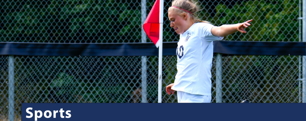 Sports banner featuring a Women's soccer player on the turf.