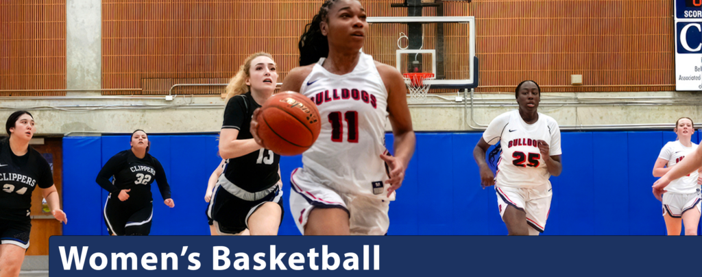 Bellevue player driving down the court with players on both teams following.