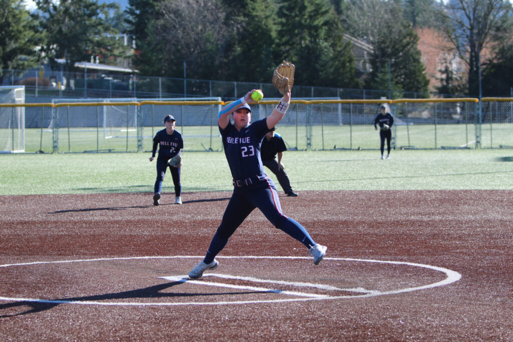 Pitcher partially airborne with one leg extended delivering a pitch.