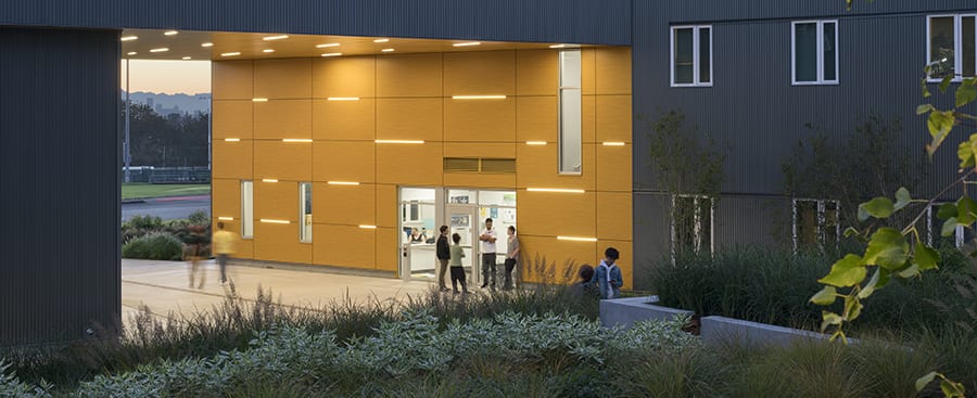 Students in courtyard in front of Residence Hall office.