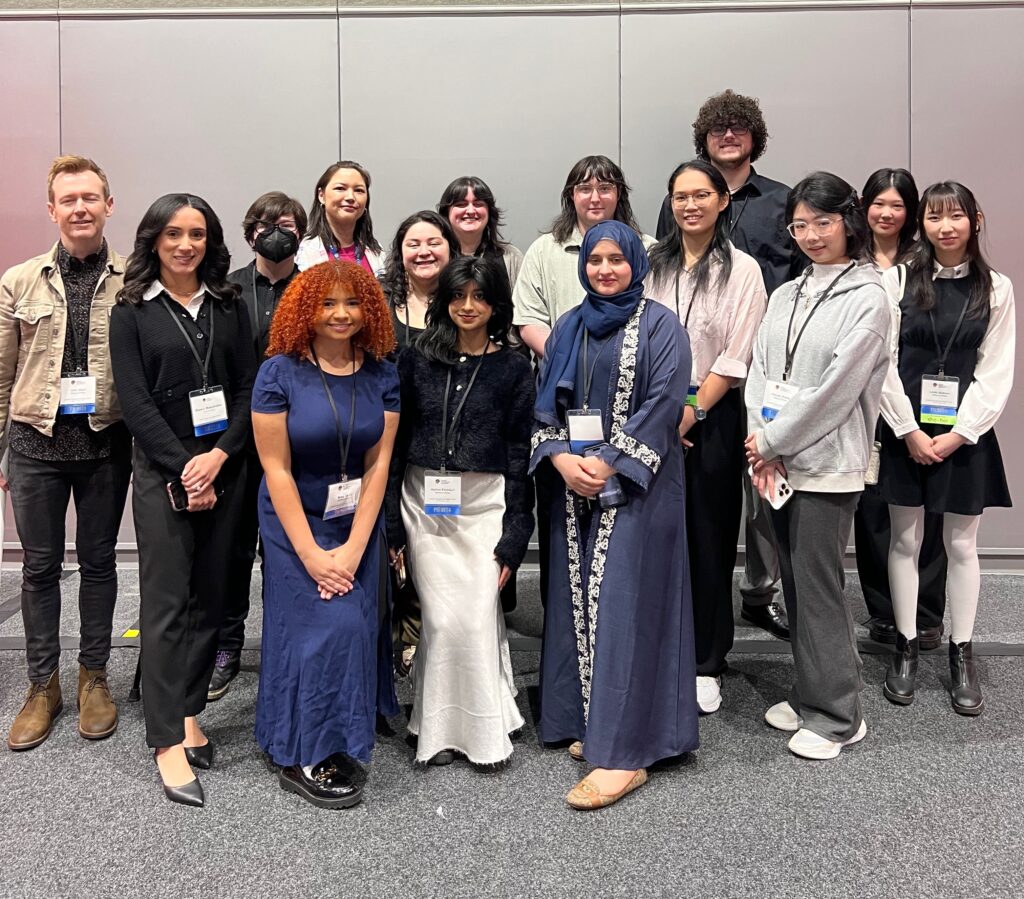 Group Photo of students and faculty at conference. 