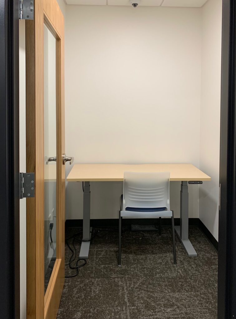 a picture of a DRC Private Testing Room. The doors open inward, and the desks are adjustable. 