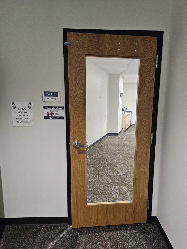 The testing center door from the DRC lobby. The door has a glass center so you can see into the testing center.