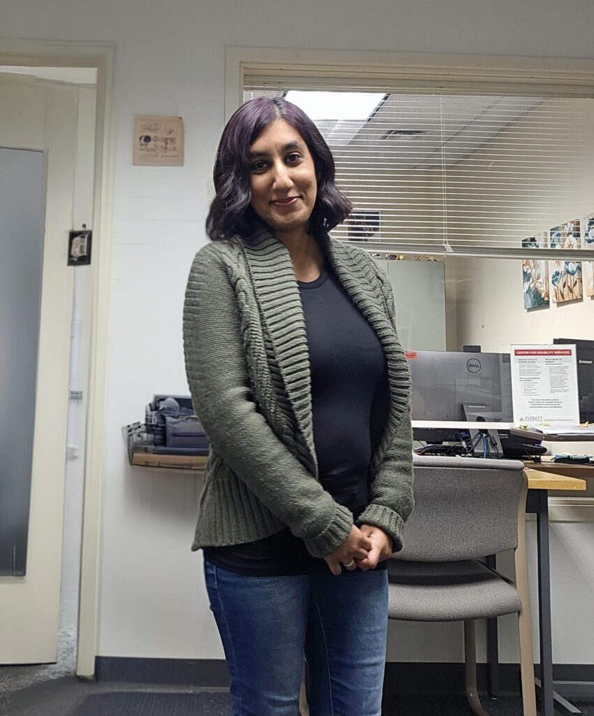 Program Assistant Tabassam Ramzan wearing a grey cardigan. 