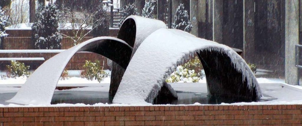 snow on the c building water fountain