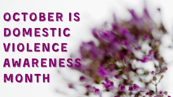 October is Domestic Violence Awareness Month purple text photo with purple flowers