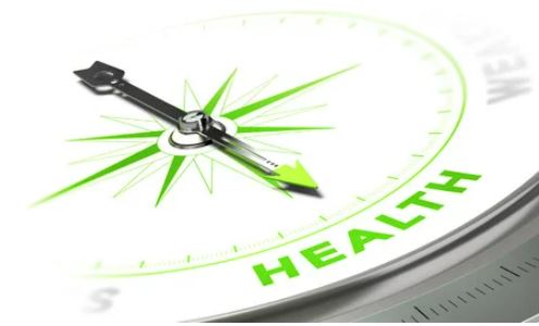 Green compass pointing to word with green text saying health