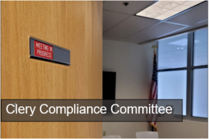 Public Safety Conference Room door opened sign reads Meeting in Progress White text reads Clery Compliance Committee