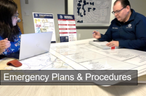 Tahn Ha and Jason Koenig sitting at a planning table. White text reads: Emergency Plans and Procedures