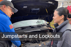 Officer and student in front of car