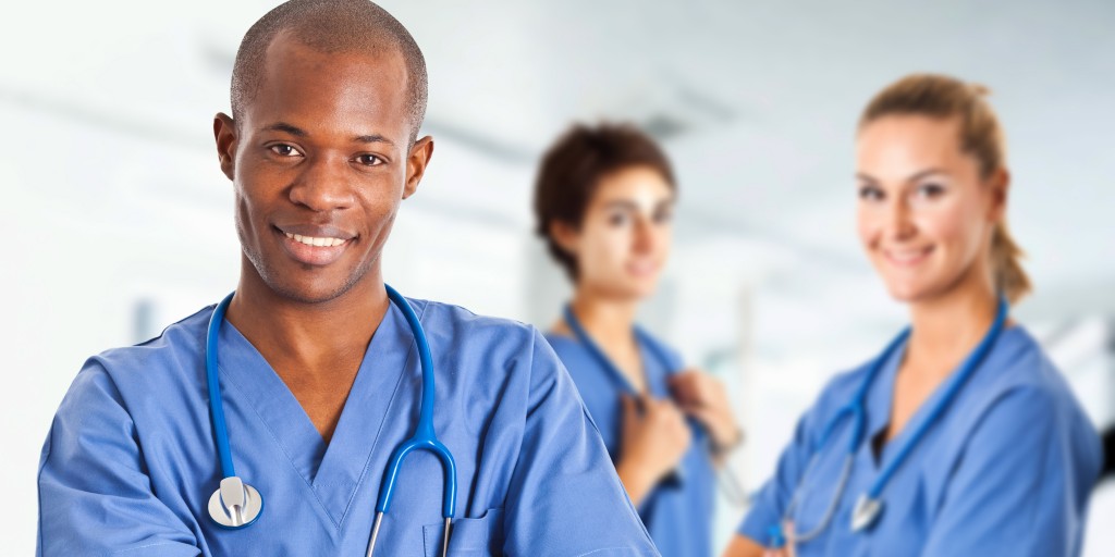 people wearing scrubs and smiling