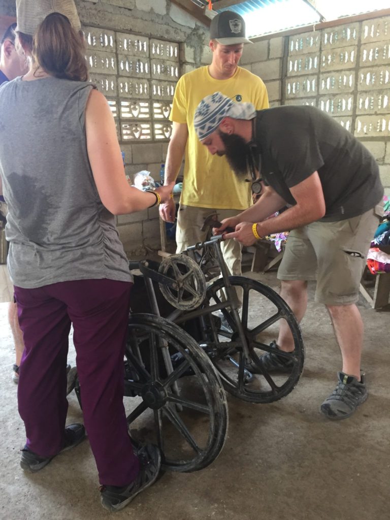 students repairing a wheelchair