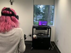 Student giving presentation in Virtual Reality Lab